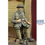 WWI British Infantryman sitting on a case