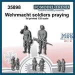 German soldiers praying