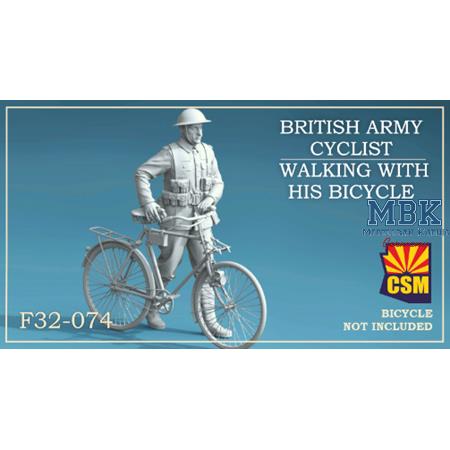 British Army Cyclist walking with his bicycle
