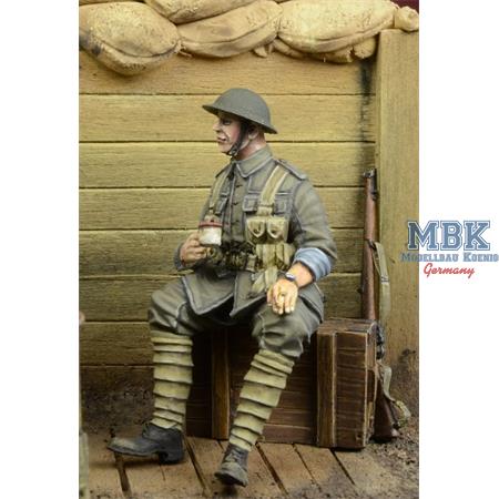 WWI British Infantryman sitting on a case