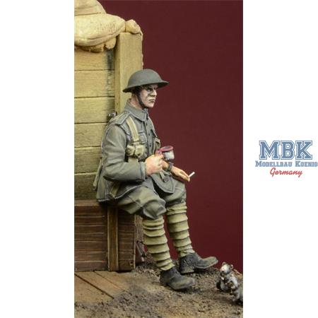 WWI British Infantryman sitting on a case