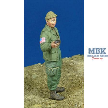 US Paratrooper giving chocolate bar, 1944-45