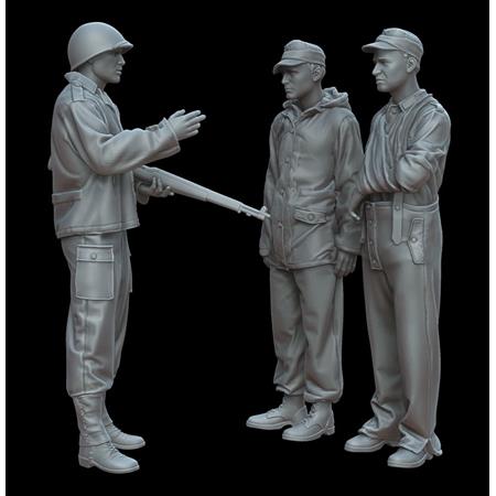 U.S. soldier with German prisoners