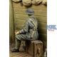 WWI British Infantryman sitting on a case